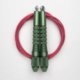 Corde à sauter verte avec câble enrobé rose